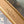 SIDE TRUNK 21 IN GRAY CREAM MONOGRAM TRIANON CANVAS GOLD HARDWARE