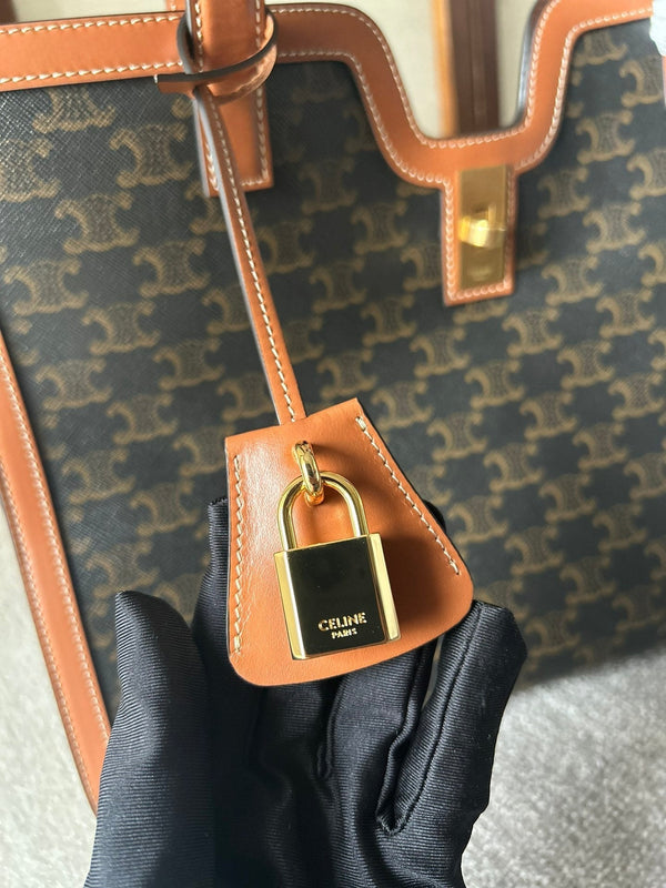 CABAS 37 IN TELA TRIOMPHE NERA E BORDI IN PELLE DI VITELLO MARRONE BRONZO CHIUSURA ORO