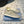 PRA TRIANGLE LOGO SNEAKERS LIGHT GRAY CALFSKIN