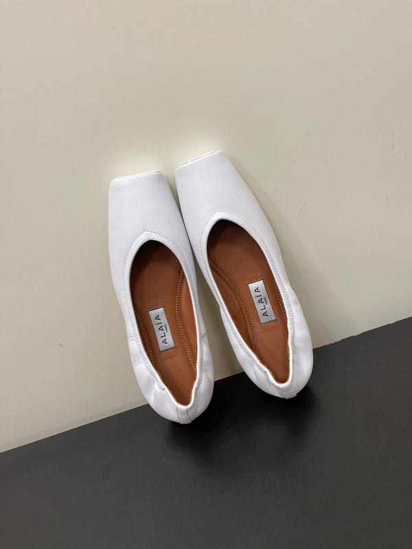 BALLERINE ALAIA IN PELLE DI VITELLO LISCIA BIANCA