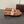 ALAIA BALLET FLATS IN COPPER BROWN MESH FISHNET WITH GOLD HARDWARE