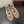 ALAIA BALLET FLATS IN WHITE MESH FISHNET WITH GOLD HARDWARE