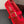 ALAIA BALLET FLATS IN CHERRY RED MESH FISHNET