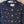 Cardigan en laine noire Chanel 2025 avec embellissement en strass