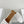ALAIA VIENNE FLAT MULES IN WHITE LAMBSKIN
