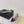 ALAIA LE COEUR FLAT SLINGBACKS IN BLACK PATENT LAMBSKIN