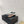ALAIA LE COEUR FLAT SLINGBACKS IN BLACK PATENT LAMBSKIN