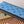 Portafoglio verticale LV Zippy in tela monogramma azzurro e pelle Taïga 180051