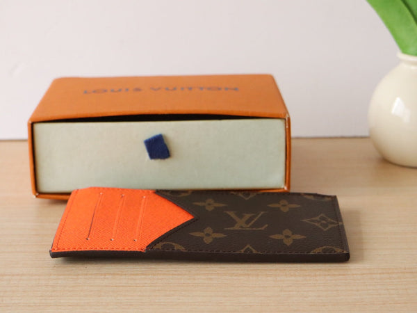Porta carte con cerniera LV in tela monogramma arancione e pelle di vitello 224125