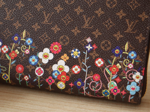 Portafoglio LVxTM Zippy in tela marrone con monogramma e motivi floreali