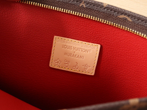Pochette da toilette LV x TM in tela marrone con monogramma e motivi floreali
