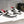 CL 25 Astroloubi Couple's Sneaker Black White Cowhide 323158