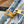 ONTHEGO EAST WEST 25 IN LAGOON BLUE MONOGRAM TILES CANVAS