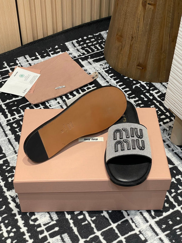 Miu 25S Beige and Black Canvas and leather slides 227133
