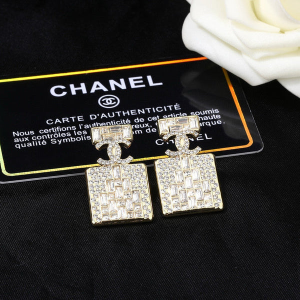 Boucles d'oreilles en or et diamant flacon de parfum CC