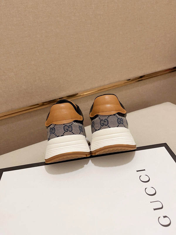 Sneaker da uomo GG in tessuto di pelle di pecora nera e grigia 529027