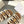 TIPPI SLIDE IN WHITE SHEARLING AND BROWN CALFSKIN
