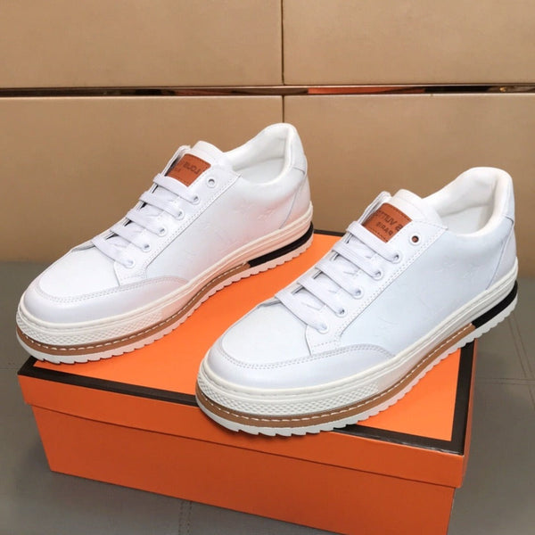 LV TRAINER IN EMBOSSED WHITE SUEDE