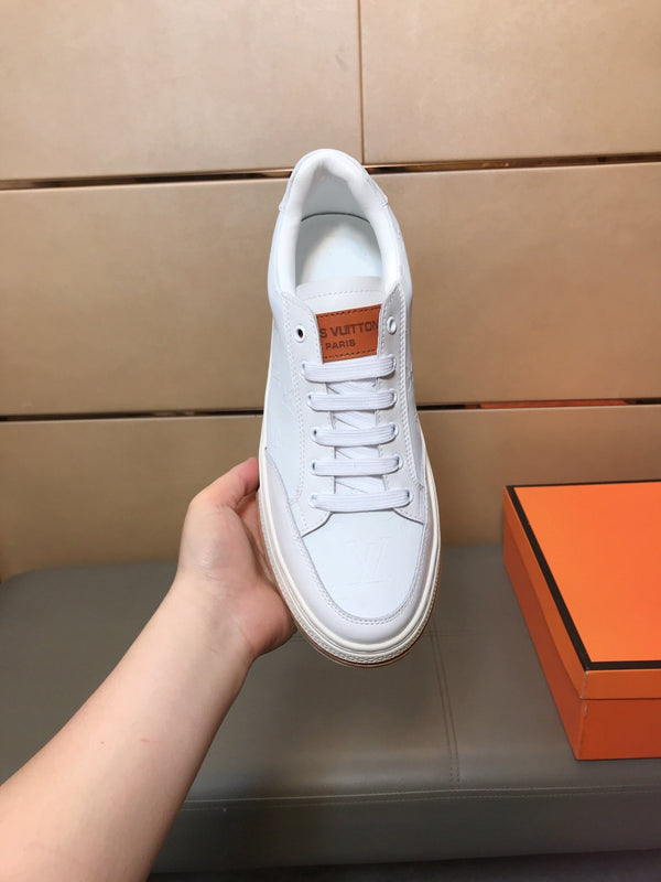 LV TRAINER IN EMBOSSED WHITE SUEDE