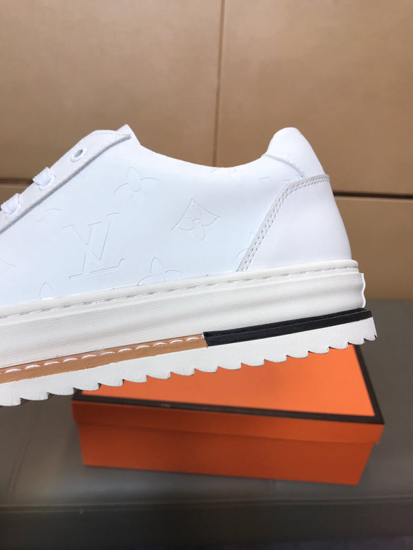 LV TRAINER IN EMBOSSED WHITE SUEDE