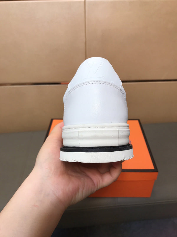LV TRAINER IN EMBOSSED WHITE SUEDE