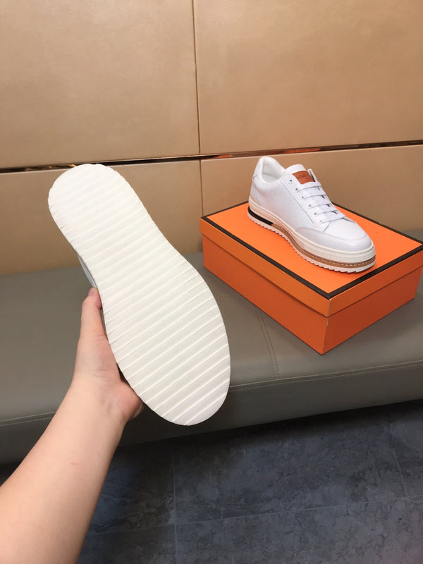 LV TRAINER IN EMBOSSED WHITE SUEDE