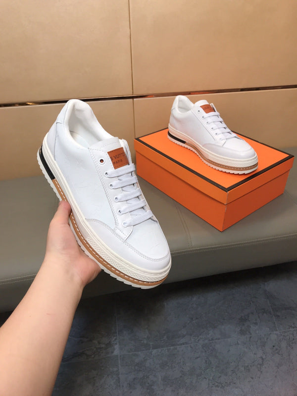 LV TRAINER IN EMBOSSED WHITE SUEDE