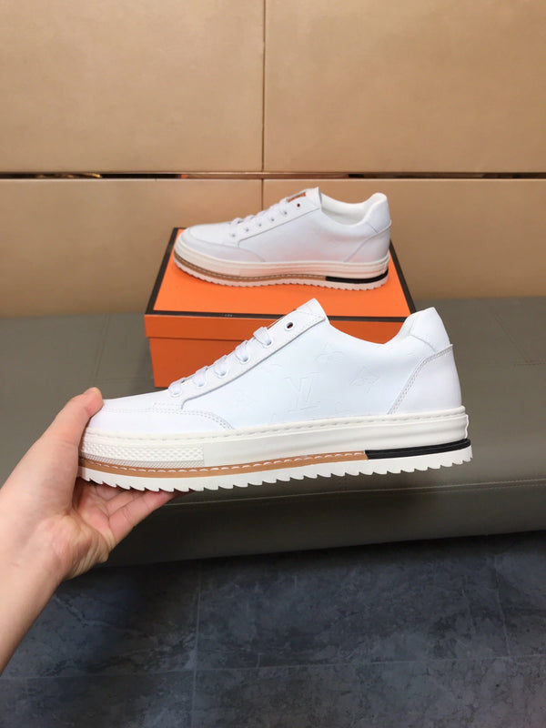 LV TRAINER IN EMBOSSED WHITE SUEDE