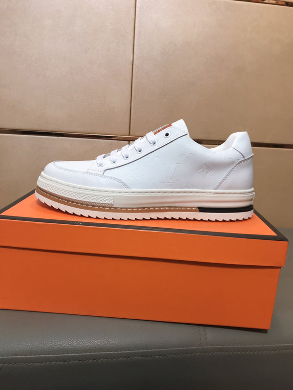 LV TRAINER IN EMBOSSED WHITE SUEDE