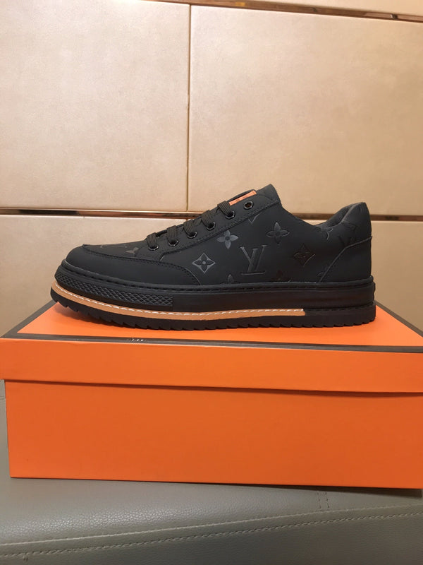 LV TRAINER IN EMBOSSED BLACK SUEDE