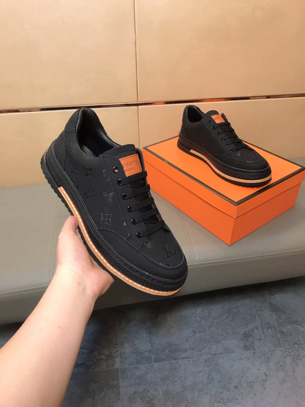 LV TRAINER IN EMBOSSED BLACK SUEDE