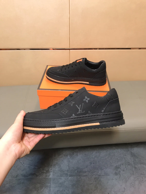 LV TRAINER IN EMBOSSED BLACK SUEDE