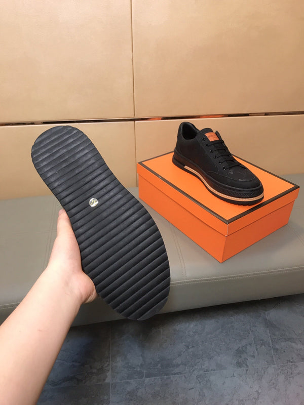LV TRAINER IN EMBOSSED BLACK SUEDE