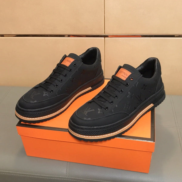 LV TRAINER IN EMBOSSED BLACK SUEDE