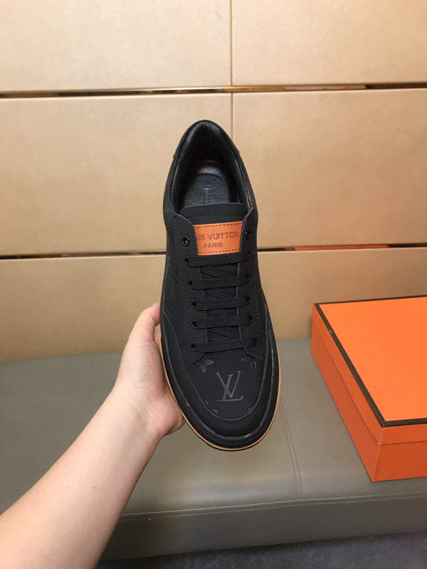LV TRAINER IN EMBOSSED BLACK SUEDE