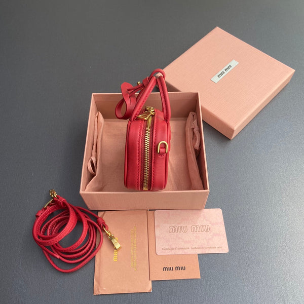MICRO BAG KEYCHAIN 11 IN TALL POPPY RED CALFSKIN EMBOSSED LOGO