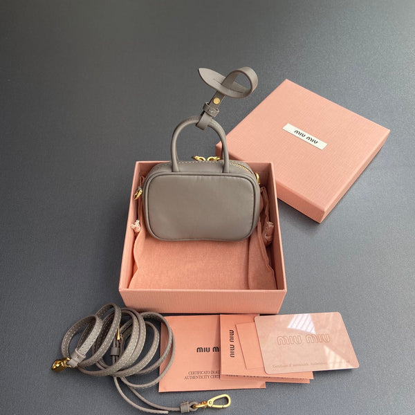 MICRO BAG KEYCHAIN 11 IN CLAY GREY CALFSKIN GOLD HARDWARE EMBOSSED LOGO