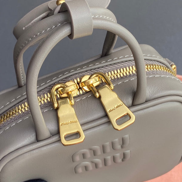 MICRO BAG KEYCHAIN 11 IN CLAY GREY CALFSKIN GOLD HARDWARE EMBOSSED LOGO