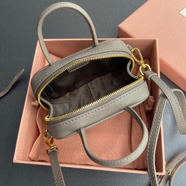 MICRO BAG KEYCHAIN 11 IN CLAY GREY CALFSKIN GOLD HARDWARE EMBOSSED LOGO