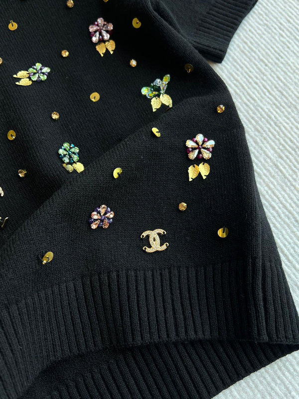CC 25SS Maglia a maniche corte con fiori in lana nera 229493