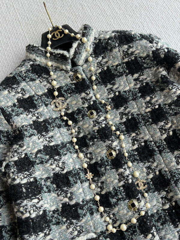 Chanel 2025 Veste en tweed à carreaux noir Laine Polyester 325363