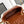 Borsa a patta Mini 18 cm in pelle di agnello Sherling bianca e marrone, finiture dorate 
