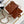 Borsa a patta Mini 18 cm in pelle di agnello Sherling bianca e marrone, finiture dorate 