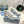 SNEAKERS PRA DOWNTOWN PERFORATE IN PELLE DI VITELLO BIANCA E GRIGIA