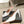 ALAIA SPIKE JEWEL MULES IN WHITE CALFSKIN