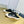 SNEAKER MULES IN BLACK CANVAS GRAFFITI LOGO