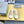 SNEAKER MULES IN WHITE CANVAS GRAFFITI LOGO