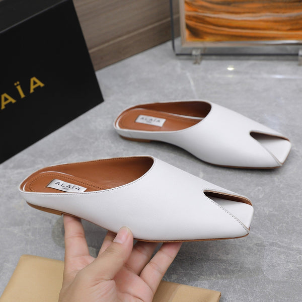 MULE PIATTA ALAIA IN PELLE DI AGNELLO BIANCA