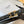 CL Gold 25mm Triomphe Enamel Black Cowhide 607413