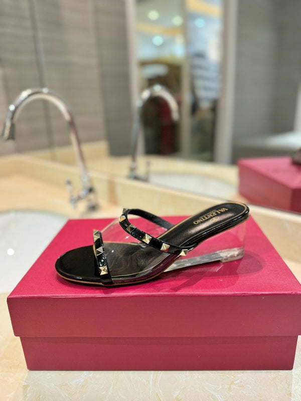 ROCKSTUD MULE SANDALS IN BLACK CALFSKIN AND TRANSPARENT PVC FILM